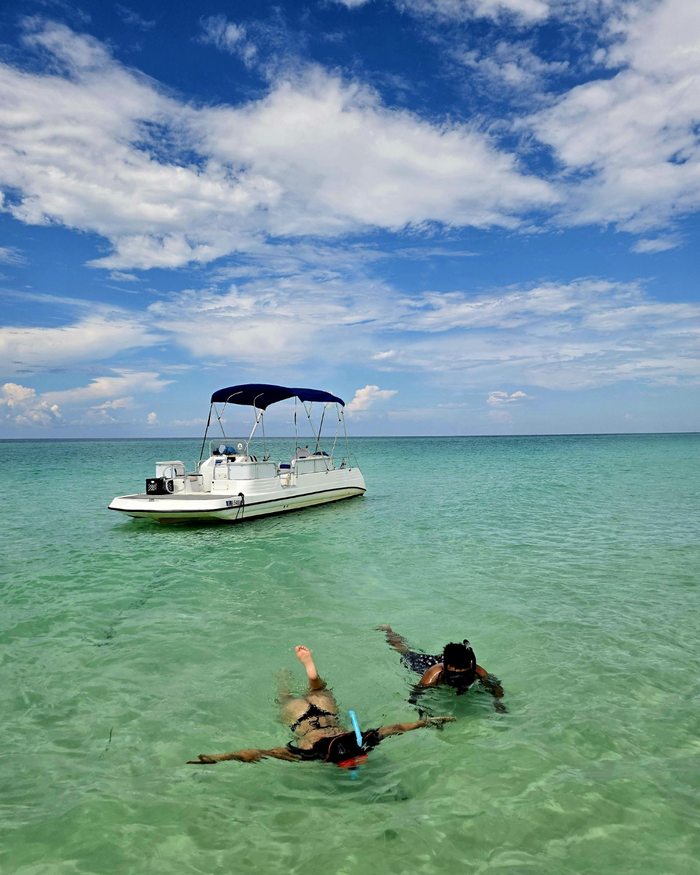 Snorkeling in clear water off Diani Beach